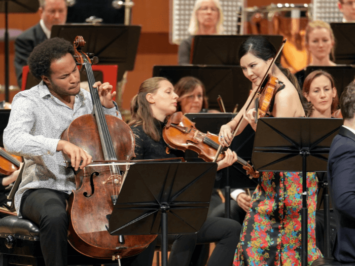 An orchestra performing a concerto live.